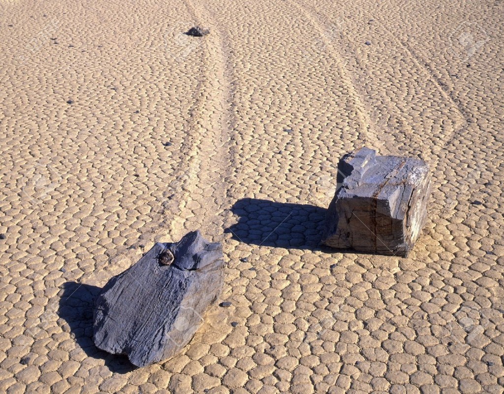 760733-Two-rocks-and-theie-trails-on-the-Racetrack-Playa-in-Death-Valley-National-Park-California--Stock-Photo